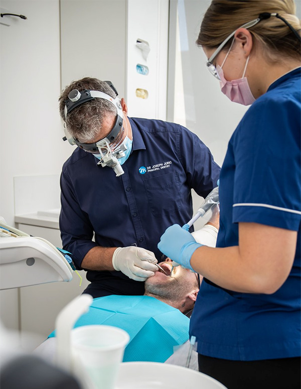 two dentists from Geelong's dental centre Myers Street Dental perform gentle work on a patient